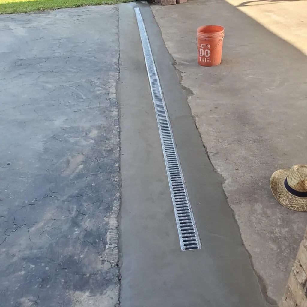 Residential drainage system installed to move water away from a foundation