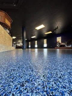 Rock Famous Foundation Repair applying epoxy flooring in Tulsa, OK